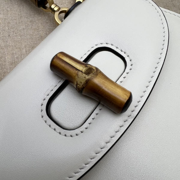 G*u*i mini top handle bag with bamboo