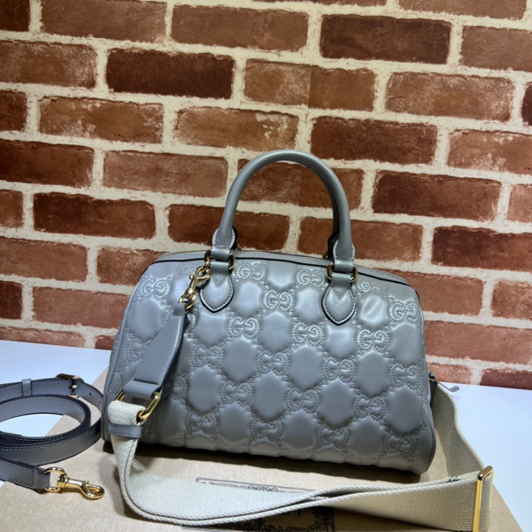 G*u*i gg matelassé leather top handle bag