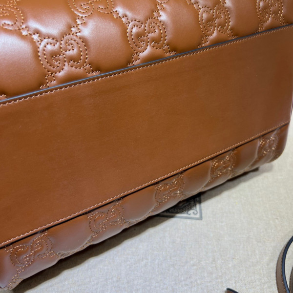 G*u*i gg matelassé leather top handle bag